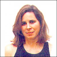 Monica Drum Woman with shoulder-length brown hair